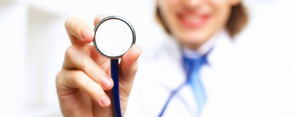 doctor holds his stethoscope to listen